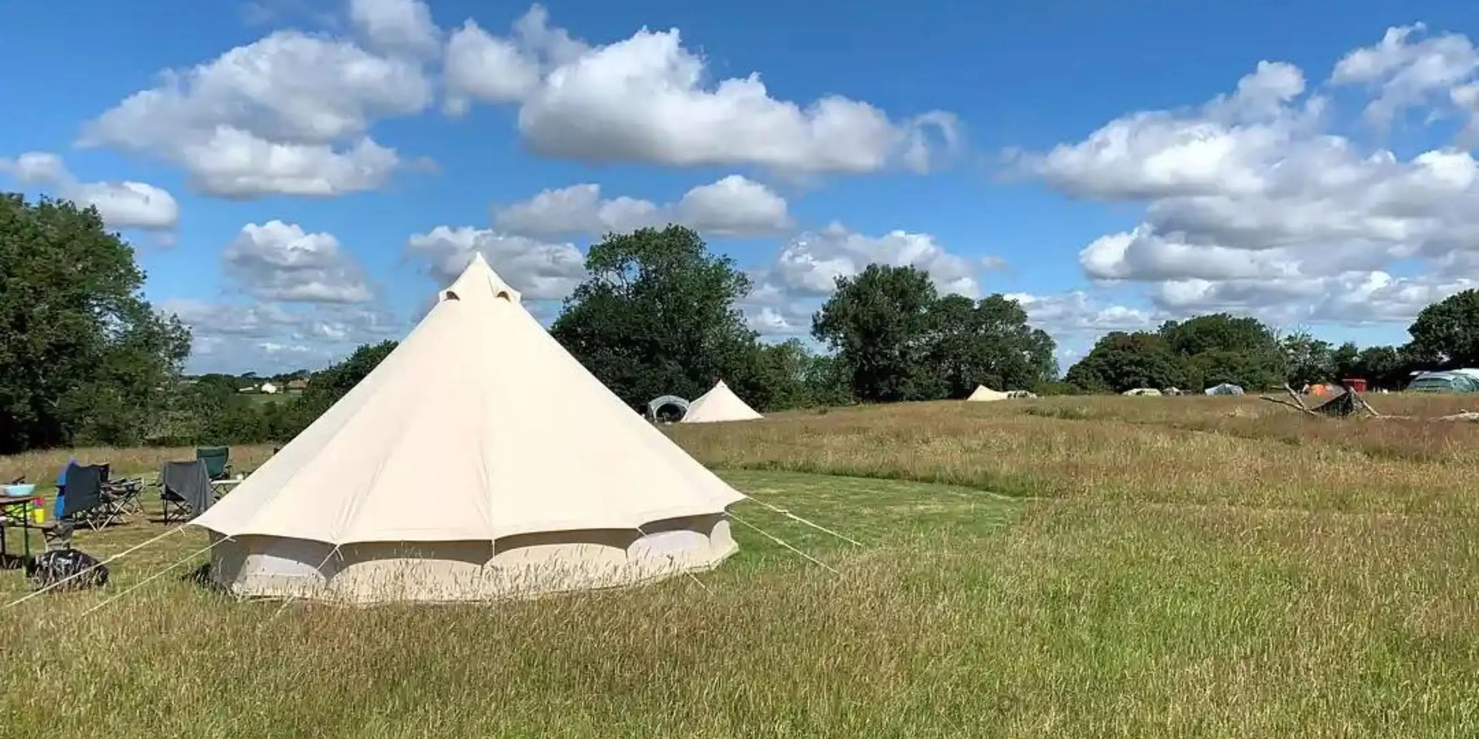 Exclusive Group Bell Tent Bookings: What Sunnyfield Offers vs. Full-Site Exclusive Hire